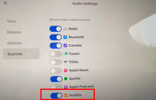 enable audible app on tesla audio settings